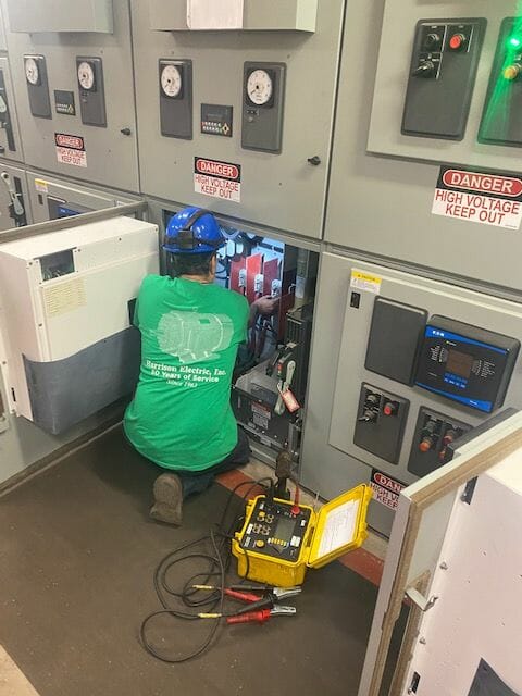 Technician testing a Slip Ring Motor from the control Panel